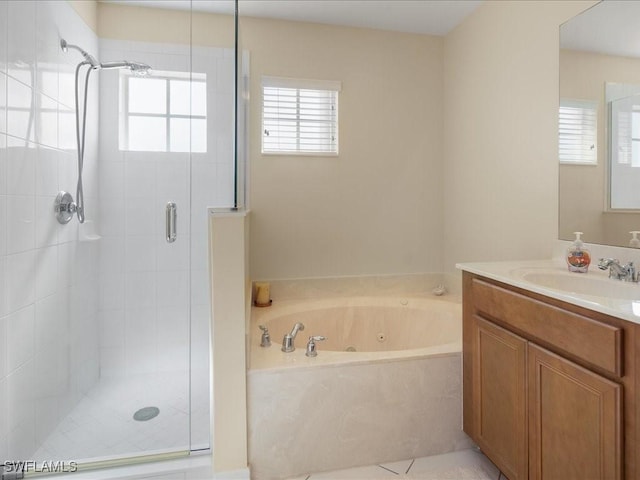 bathroom featuring vanity and shower with separate bathtub