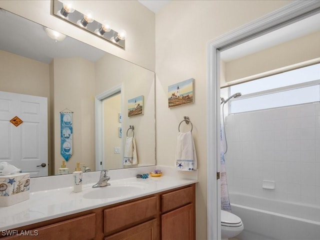 full bathroom featuring vanity, shower / tub combo, and toilet