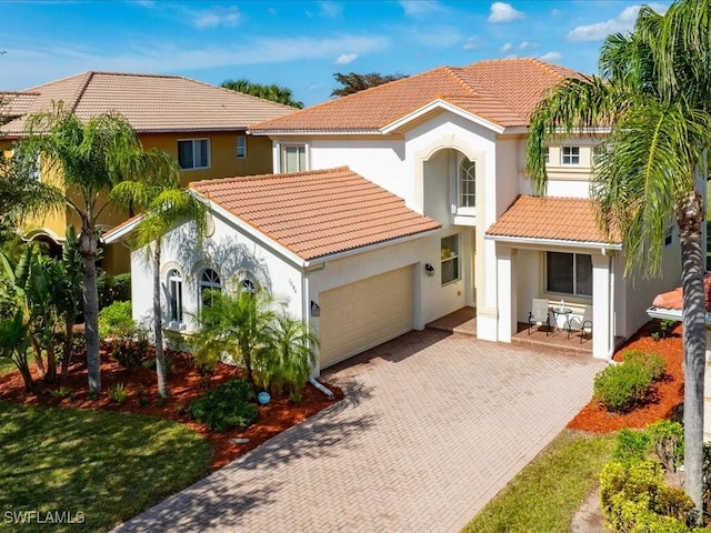 mediterranean / spanish-style house featuring a garage