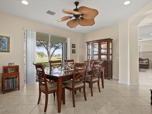 tiled dining room featuring ceiling fan