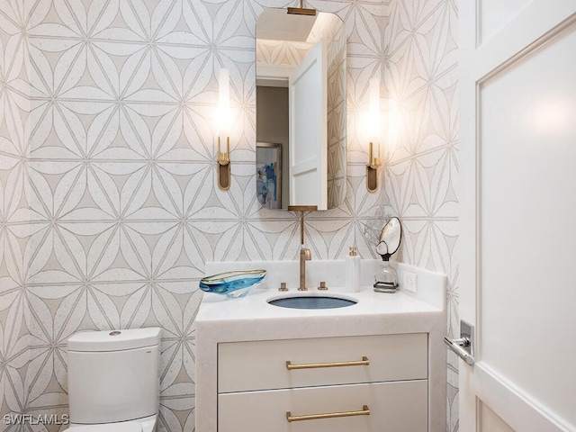 bathroom with vanity and toilet