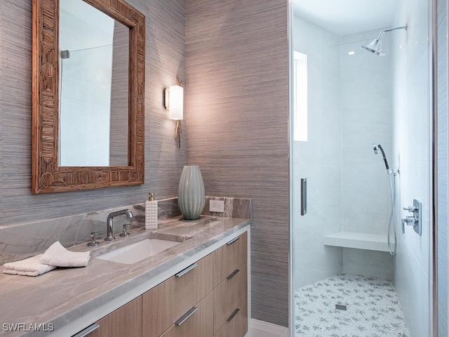 bathroom featuring vanity and a shower