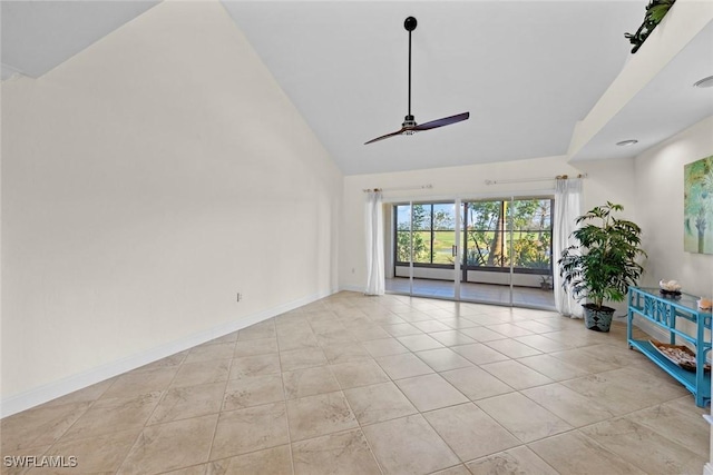 unfurnished living room with light tile patterned floors, high vaulted ceiling, and ceiling fan