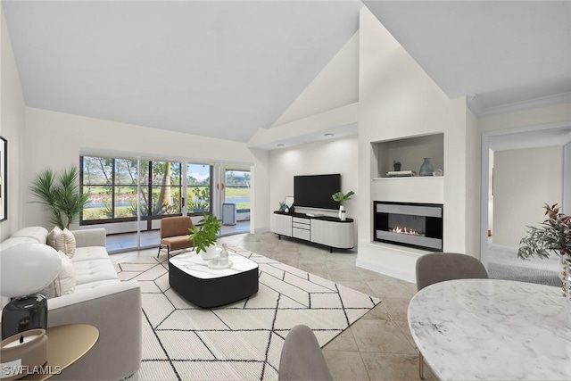 living area with light tile patterned floors, built in shelves, high vaulted ceiling, and a glass covered fireplace