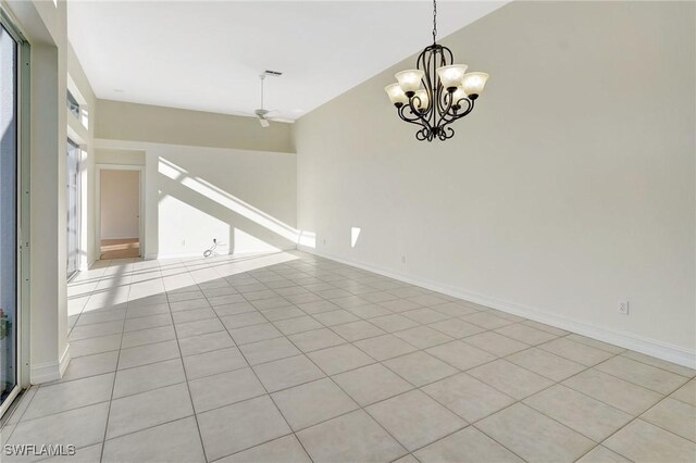 tiled spare room with ceiling fan with notable chandelier