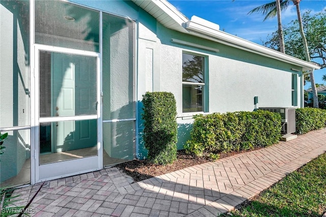 view of property exterior featuring stucco siding and a patio