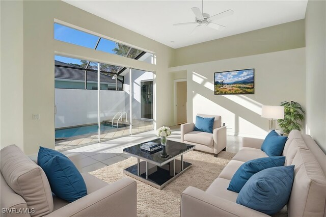 living room with ceiling fan and light tile patterned floors