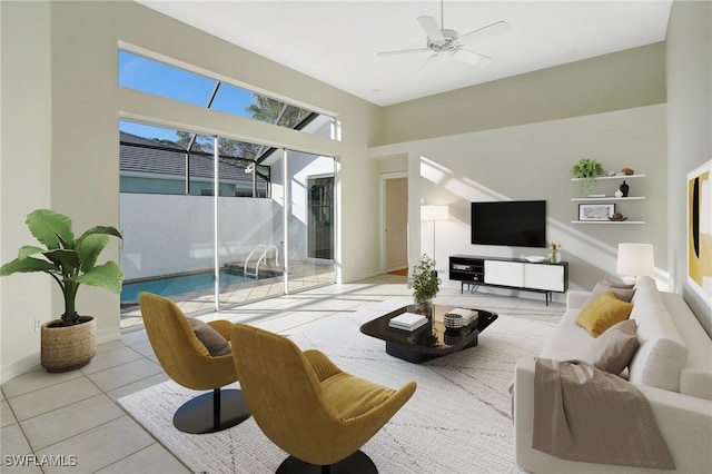 living room featuring ceiling fan and light tile patterned floors