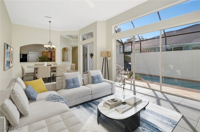 living room featuring a notable chandelier