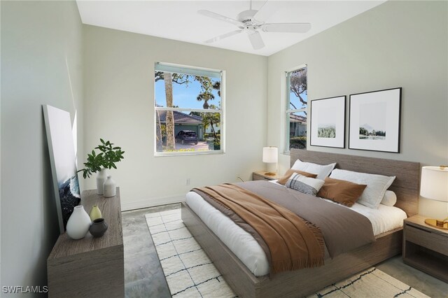 bedroom featuring wood finished floors, ceiling fan, and baseboards