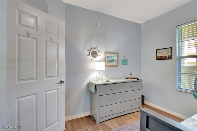 bedroom with light hardwood / wood-style floors