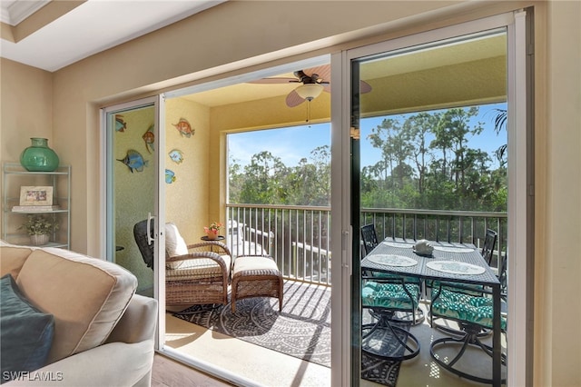 sunroom featuring ceiling fan