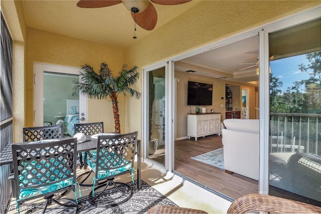 balcony featuring ceiling fan