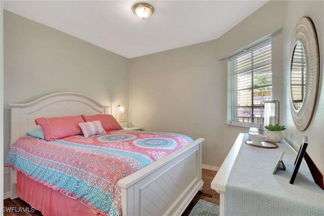 bedroom with hardwood / wood-style floors