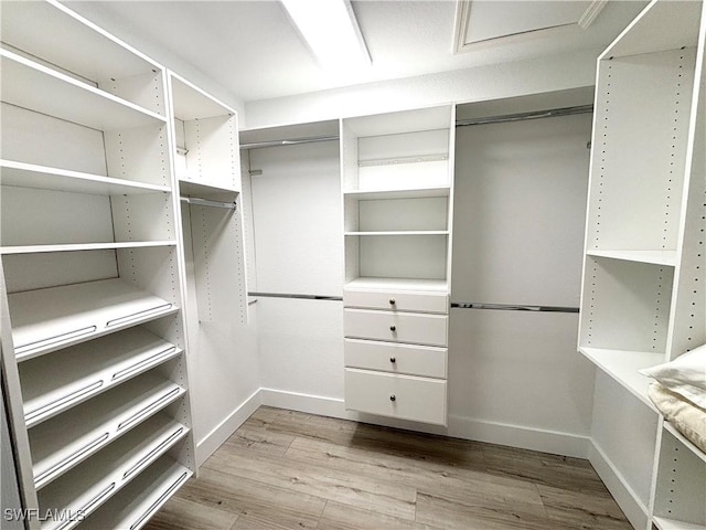 spacious closet with wood finished floors