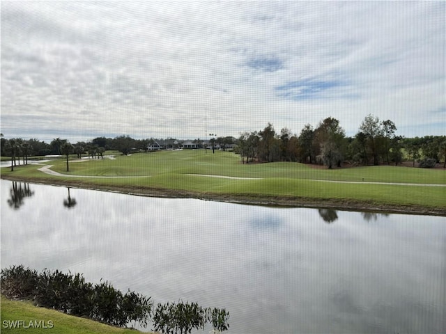 view of home's community with a water view and view of golf course