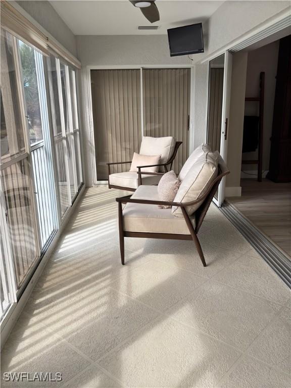 unfurnished sunroom with visible vents