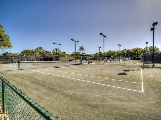 view of sport court with fence