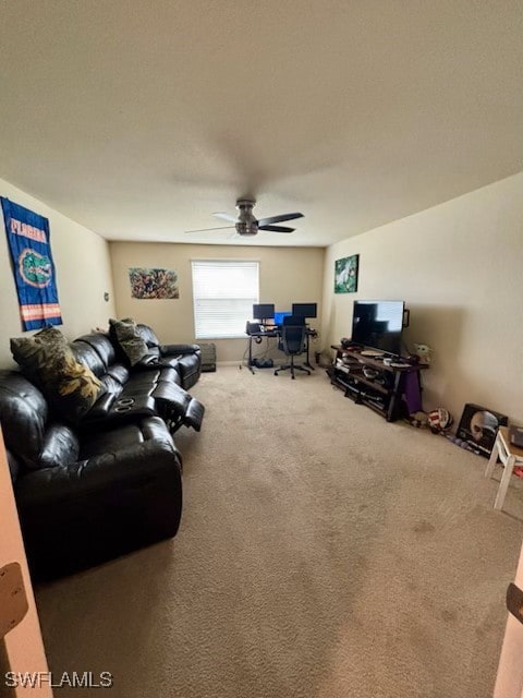 living room with carpet and ceiling fan