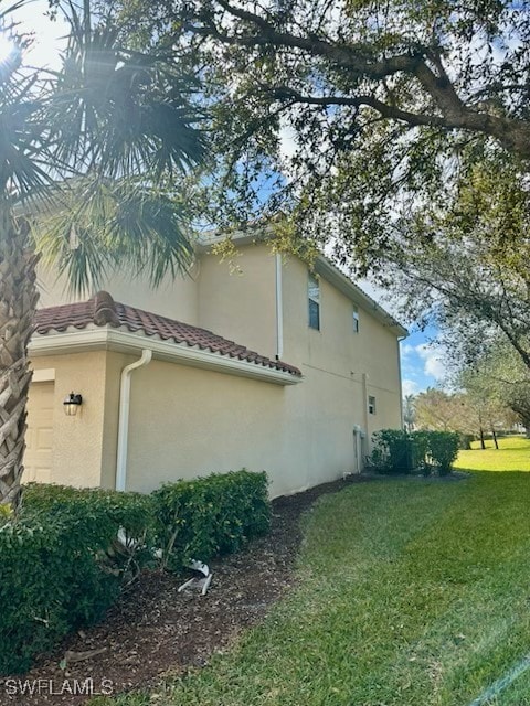 view of property exterior featuring a yard