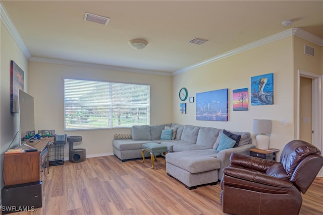 living room featuring crown molding and light hardwood / wood-style floors