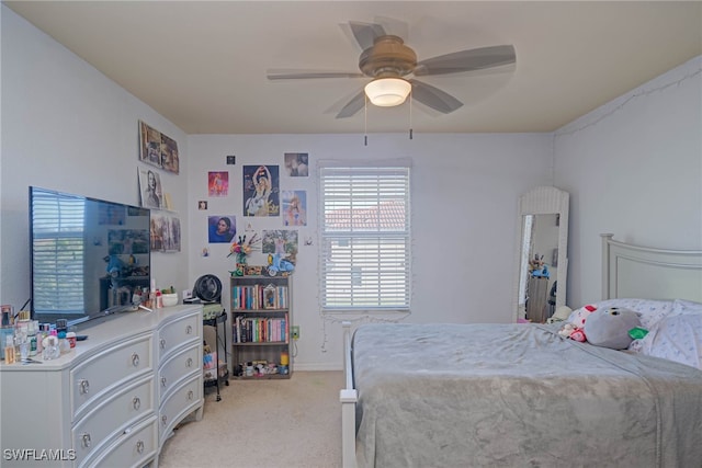 carpeted bedroom featuring ceiling fan