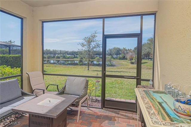 sunroom with a water view