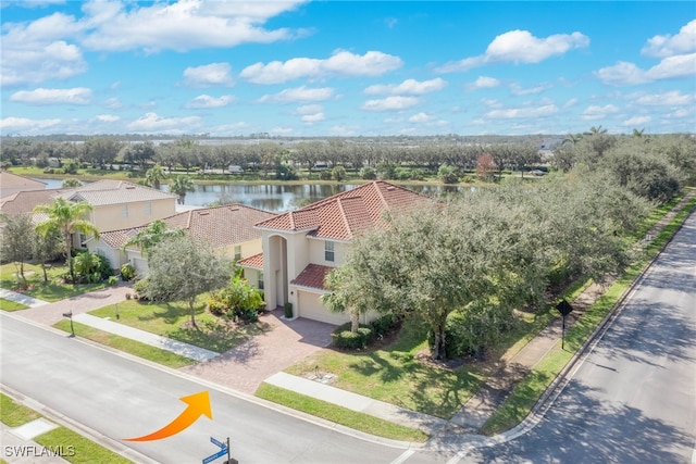 birds eye view of property with a water view