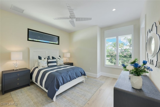 bedroom with ceiling fan and light wood-type flooring