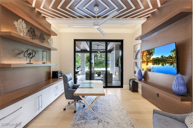 home office featuring ceiling fan and light hardwood / wood-style floors