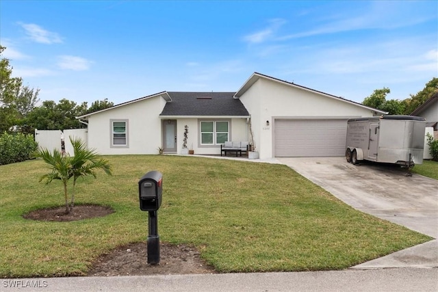 ranch-style home with a garage and a front lawn