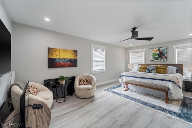 bedroom featuring ceiling fan and light hardwood / wood-style floors