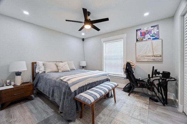 bedroom with hardwood / wood-style floors and ceiling fan