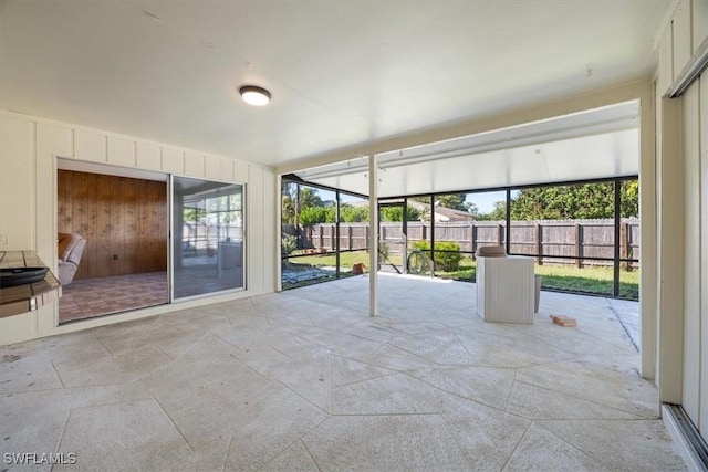 unfurnished sunroom featuring a healthy amount of sunlight