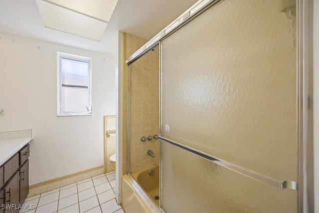 bathroom with vanity, tile patterned floors, and combined bath / shower with glass door