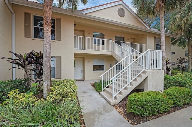 view of property featuring stairway