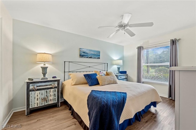 bedroom featuring light wood-type flooring, ceiling fan, and baseboards