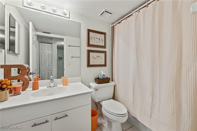 bathroom featuring tile patterned flooring, toilet, vanity, visible vents, and a shower with curtain