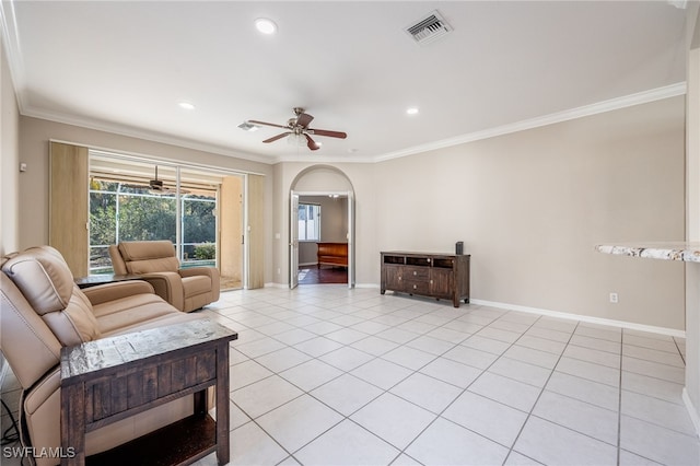 tiled living room featuring crown molding and ceiling fan