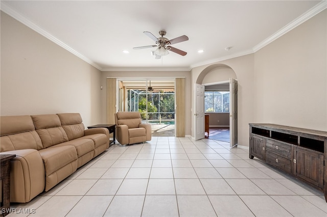 living room featuring crown molding, ceiling fan, and light tile patterned flooring