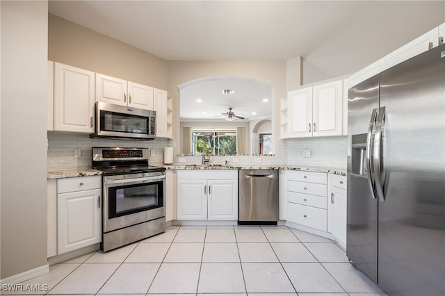 kitchen featuring white cabinetry, sink, decorative backsplash, and appliances with stainless steel finishes