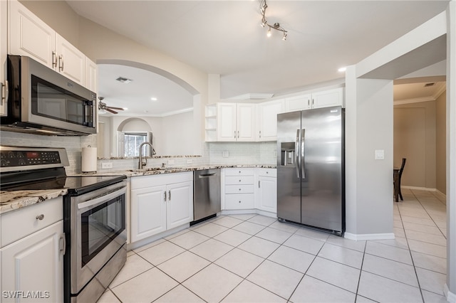 kitchen featuring white cabinetry, appliances with stainless steel finishes, sink, and light tile patterned flooring