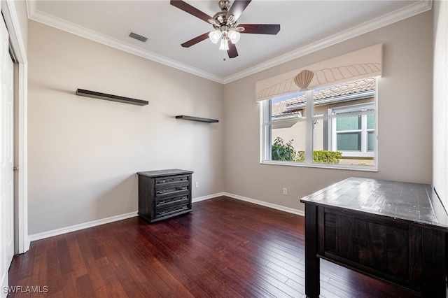 interior space with baseboards, visible vents, ceiling fan, wood-type flooring, and crown molding