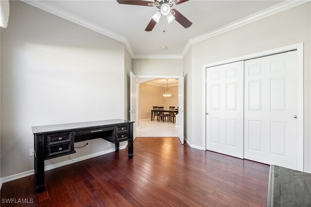 interior space with ornamental molding and dark hardwood / wood-style flooring