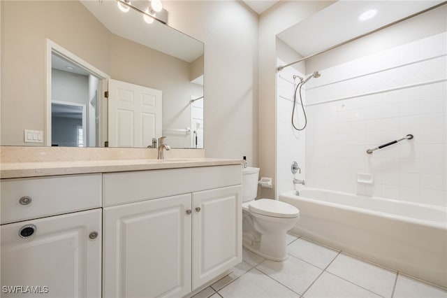 full bathroom with tiled shower / bath, tile patterned floors, toilet, and vanity