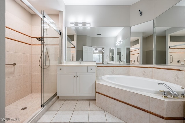 full bath featuring vanity, a stall shower, ceiling fan, tile patterned flooring, and a garden tub