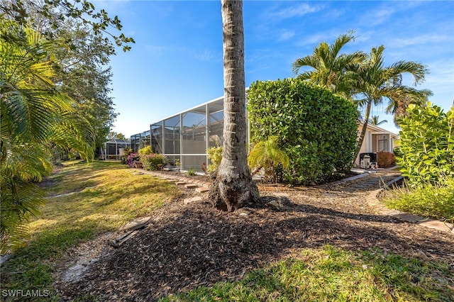 view of yard with a lanai