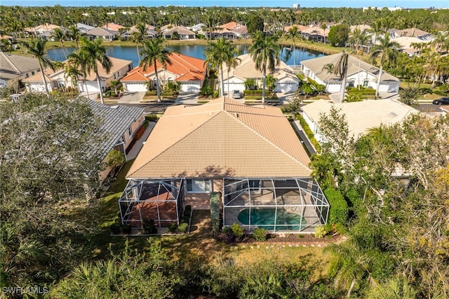 birds eye view of property with a residential view and a water view