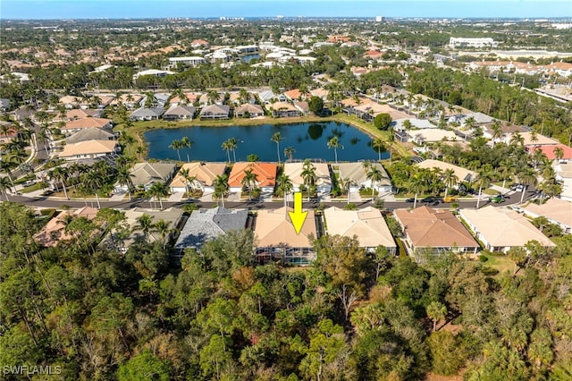 bird's eye view featuring a residential view and a water view