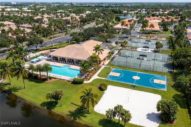 birds eye view of property with a water view